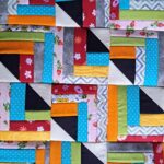 padronagem patchwork com retalhos usando técnicas triângulo perfeito e quarter log cabin
